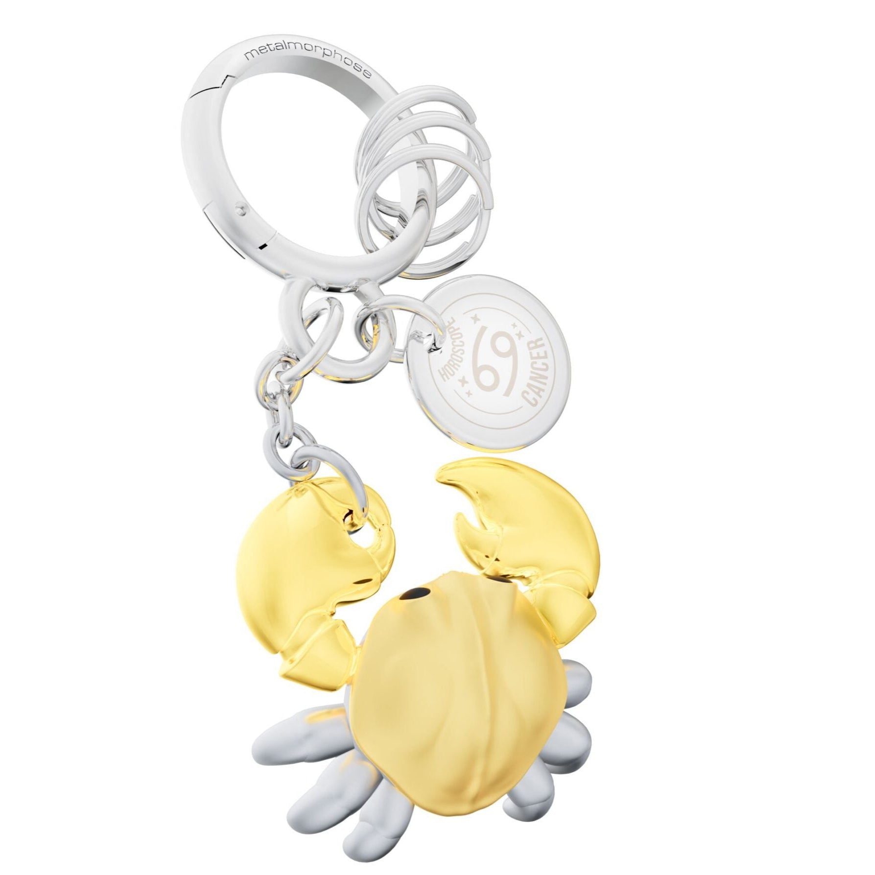 Gold crab-shaped keychain with silver accents on a white background